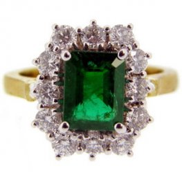 A traditional Emerald cluster ring brilliant cut diamonds
