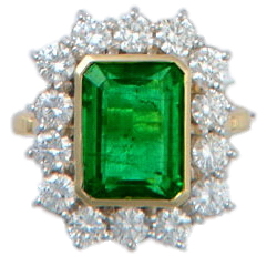 An Emerald-Cut Emerald & Diamond Cluster Ring - Click Image to Close