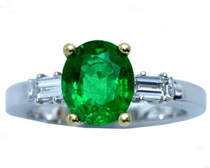 An Oval Emerald Solitaire Diamond ring - Click Image to Close