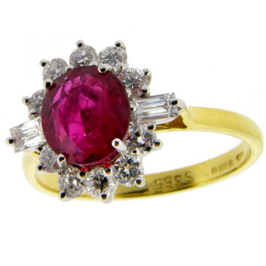 An Oval Ruby and Diamond Cluster Ring - Click Image to Close