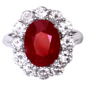 A White Gold Oval Ruby and Diamond Cluster Ring - Click Image to Close