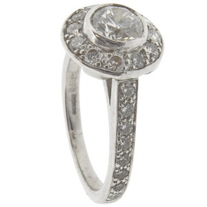 18ct white gold diamond halo cluster ring Half carat centre.